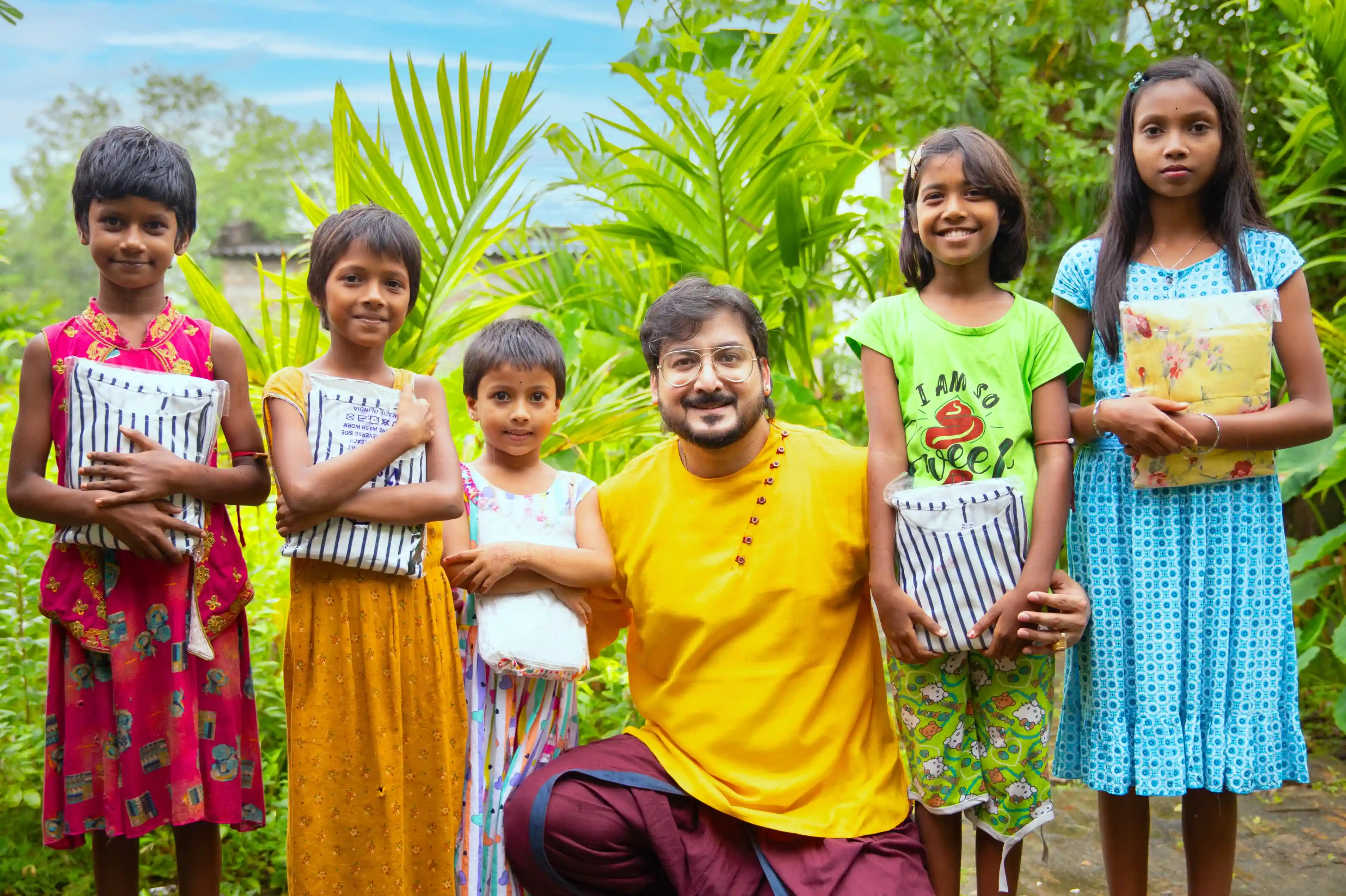 Residents, children and Nabatara Foundation volunteers gathered around a new community water point and health camp tent in a Kolkata slum, reflecting the organisation’s role as a leading community development NGO Kolkata improving daily life in underprivileged neighborhoods.